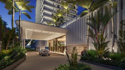 Porte-cochere entrance with palm trees at Nautica Residences, Cancun