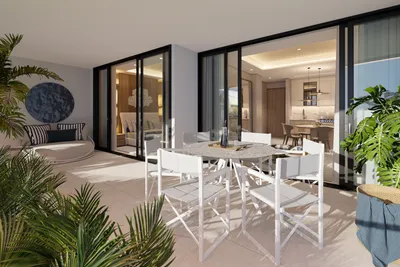 Terrace dining with glass railing and ocean view at Nautica Residences, Cancun