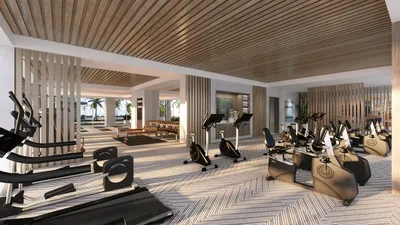 Gym with fitness equipment and wood ceiling at One Laguna, Cancun