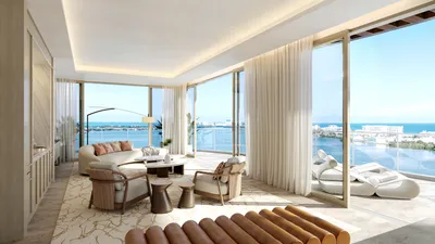 Living and dining area with balcony at One Laguna, Cancun