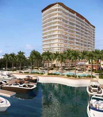 Tower with marina and pool at One Laguna, Cancun