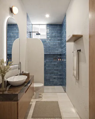 Baño con tocador de azulejo azul en Portha, Playa del Carmen