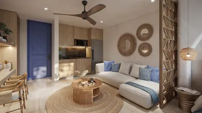 Sala con pared de acento azul en Portha, Playa del Carmen