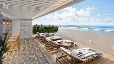 Comedor en terraza con vista al mar en Portha, Playa del Carmen