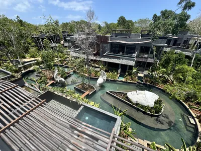 Elevated pools and walkways with panoramic jungle canopy views at Siwa Elevé wellness resort in Tulum