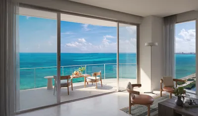 Living room with balcony and ocean view at SLS Ocean Beach Residences, Puerto Cancun
