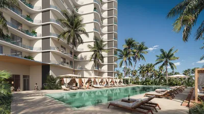 Pool deck with facade view at SLS Ocean Beach Residences, Puerto Cancun