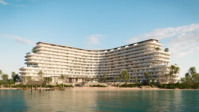 Resort waterfront with curved exterior at The Residences at The St. Regis Costa Mujeres