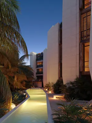 Walkway between residences at dusk at TOK Holbox