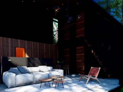 Dark living room interior with glass walls and lush jungle views at Tree60 award-winning sustainable villa