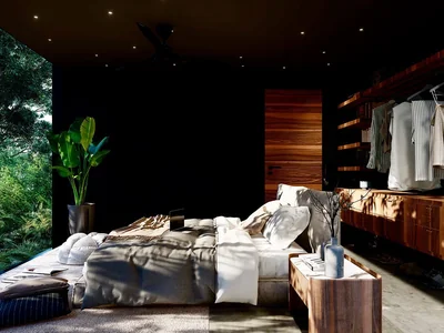 Dark suite with bedroom and open bathroom design featuring natural materials at Tree60 off-grid villa