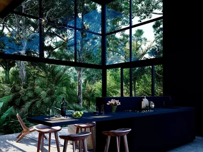 Dining room with glass walls and jungle views at Tree60 off-grid luxury villa in Aldea Zama, Tulum