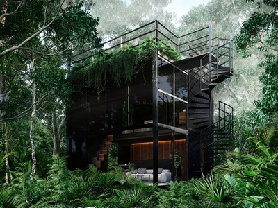 Dramatic jungle structure with exterior staircase connecting the three-story Tree60 villa in Tulum