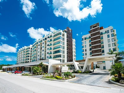 Main entrance facade with contemporary architecture at Valle Aurora residential in Playa del Carmen
