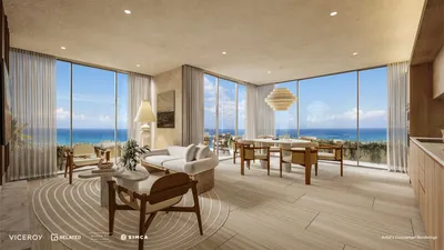 Comedor con ventanas curvas en Viceroy Residences Playa del Carmen