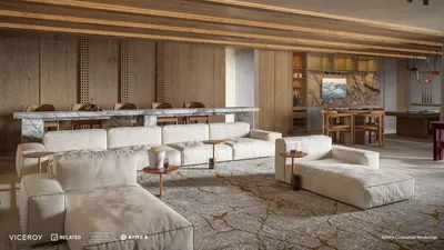 Sala con sofá seccional en Viceroy Residences Playa del Carmen