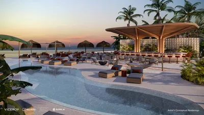 Alberca con cabanas al atardecer en Viceroy Residences Playa del Carmen