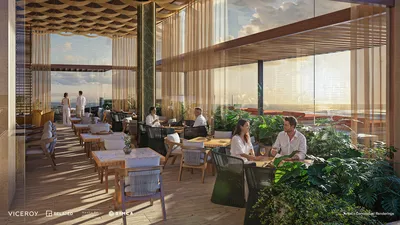 Restaurante y área de comedor con vista al océano en Viceroy Residences Playa del Carmen